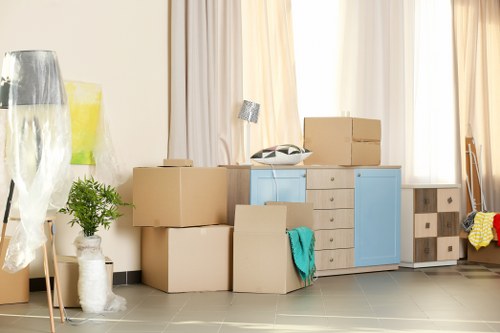 Van moving household items from a Camden flat with stairs