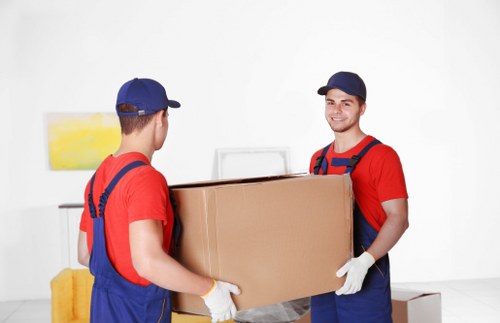 Packed office furniture and equipment ready for transport in Camden