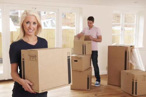 Movers handling stairs and access in a Camden property