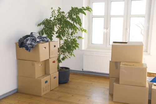 Movers handling commercial items on a Camden street with limited access