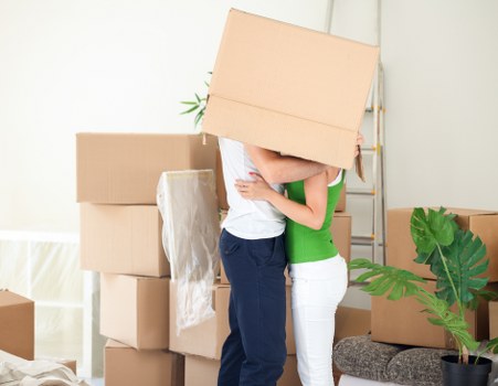 Professional movers navigating stairs in a Camden property
