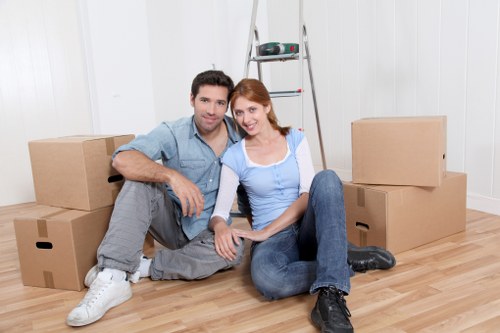 Local movers handling office furniture on a Camden street