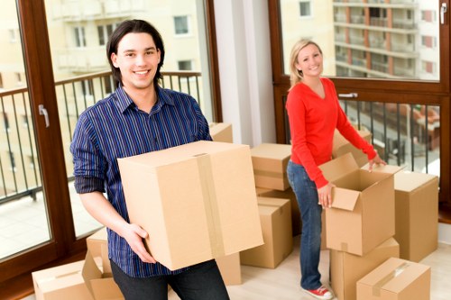 Professional movers carrying furniture in Camden